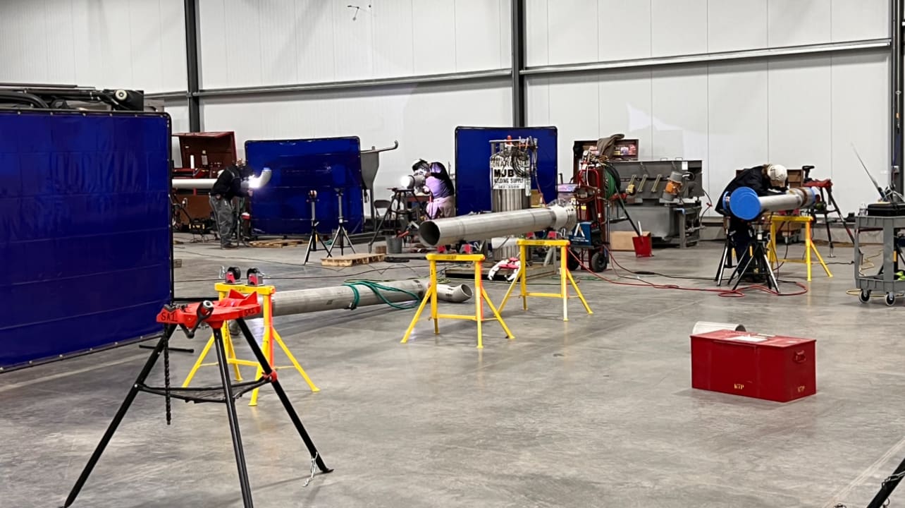 SAI 8-person crew deployed to large commercial job site - Stainless Aesthetics Inc field team