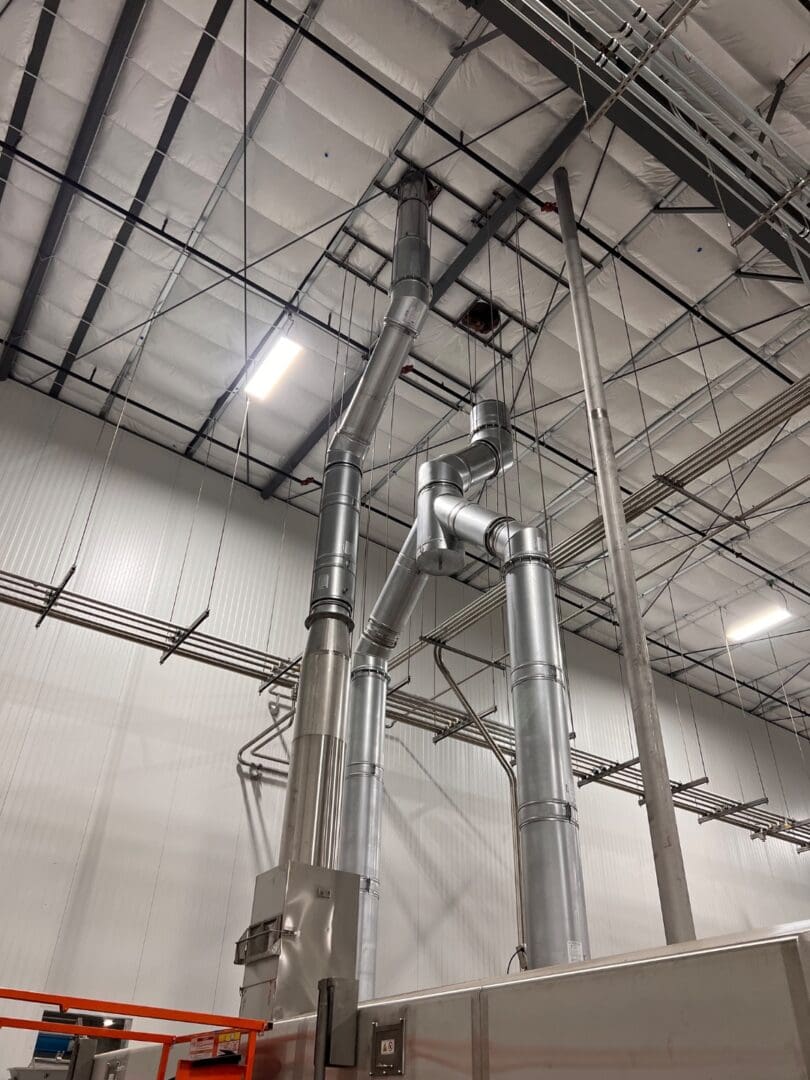 Custom stainless steel industrial ducting installation by Stainless Aesthetics Inc