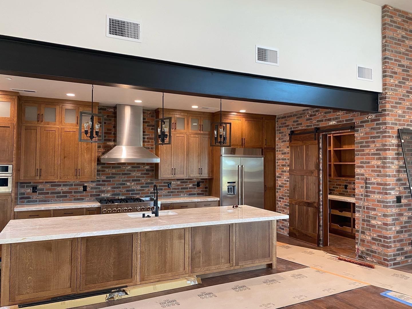 Finished exposed steel beam installation in luxury residential home - SAI